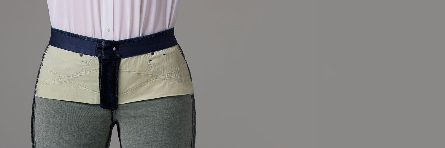 Denim jeans worn inside out to show off the pockets and construction of Lift Tuck Technology.